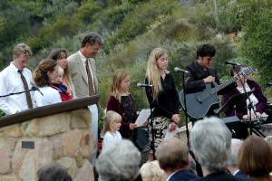 This was 2003, at Grandpa's memorial at the outdoor chapel overlooking the Thacher track. My daughter, the little girl in the center, is 5, my son (in my arms) is 2, and we're with siblings, nieces, and nephews. I often run and ride the trail on that hillside.